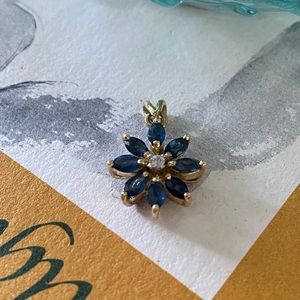 14 karat solid yellow gold and sapphire And white stone star Flower pendant